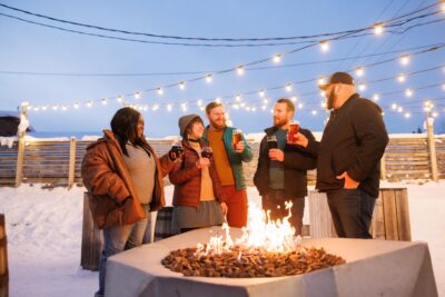 Group of young people around firepit in Fairbanks, Alaska